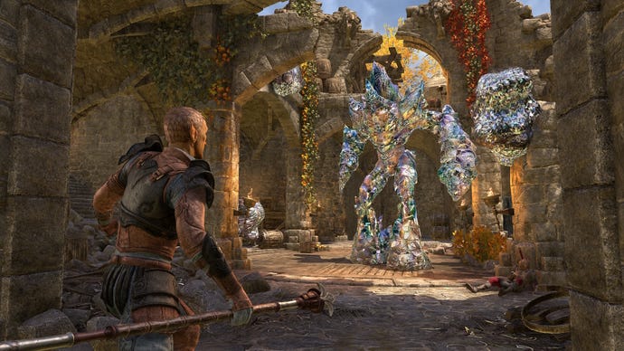 A warrior approaches a crystalline monster in some autumnal ruins in The Elder Scrolls Online's Gold Road Chapter