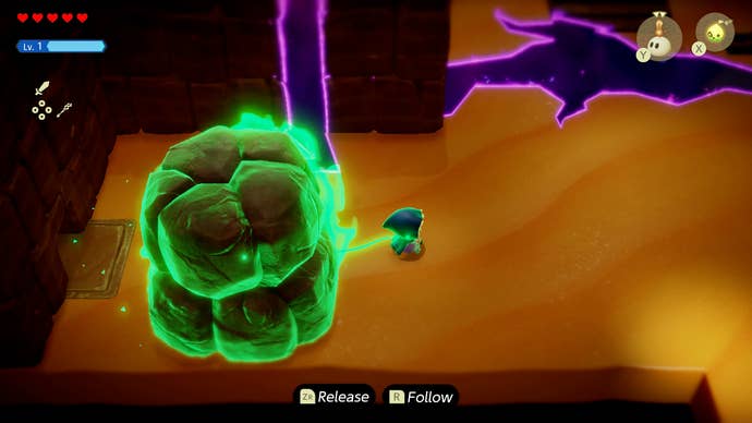 Princess Zelda pulling a giant boulder to reveal a secret door in the Ancestor’s Cave of Rest in Zelda: Echoes of Wisdom.