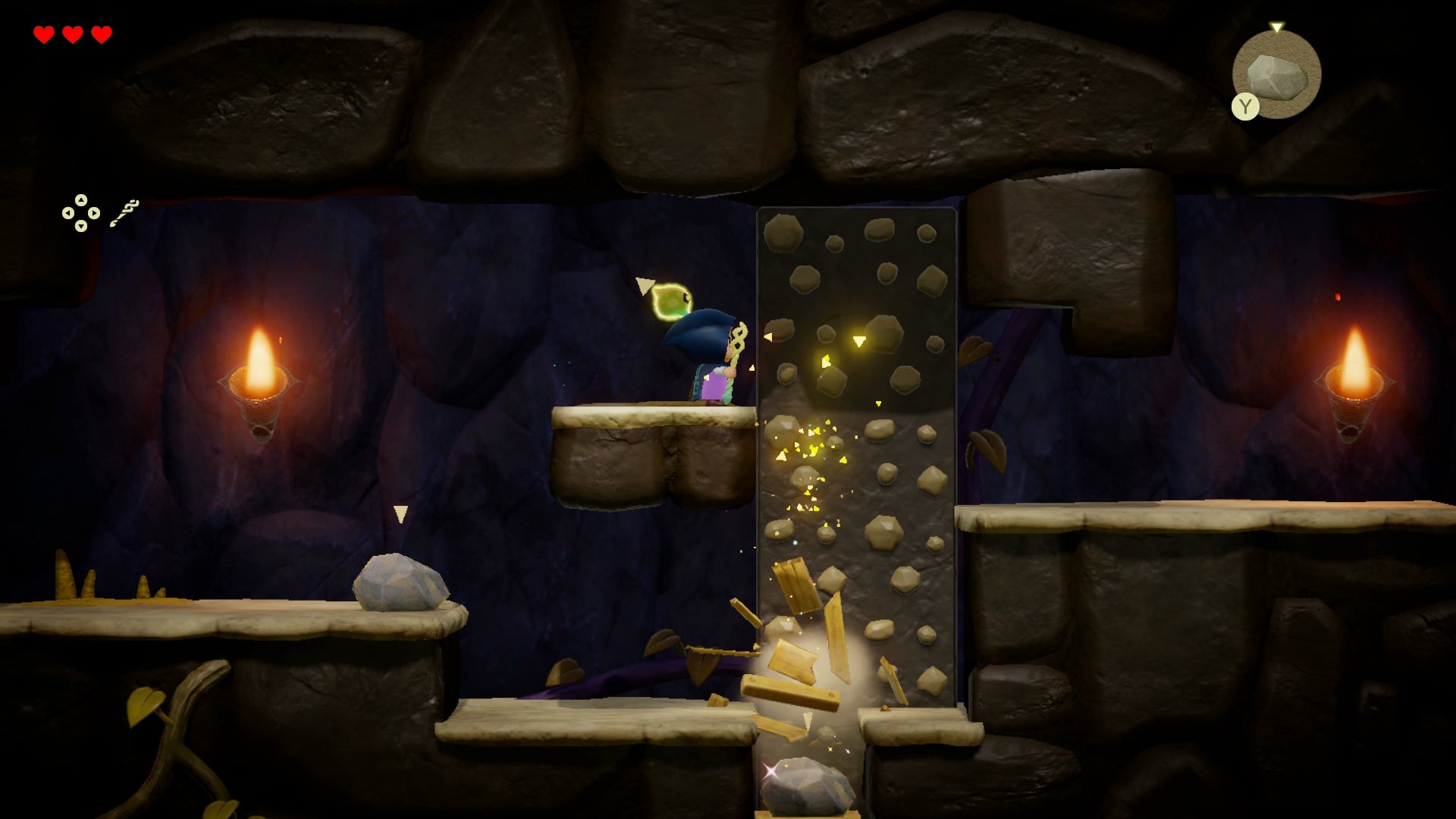 Princess Zelda dropping a rock onto some boxes in the Beach Cave in Zelda: Echoes of Wisdom. - 3