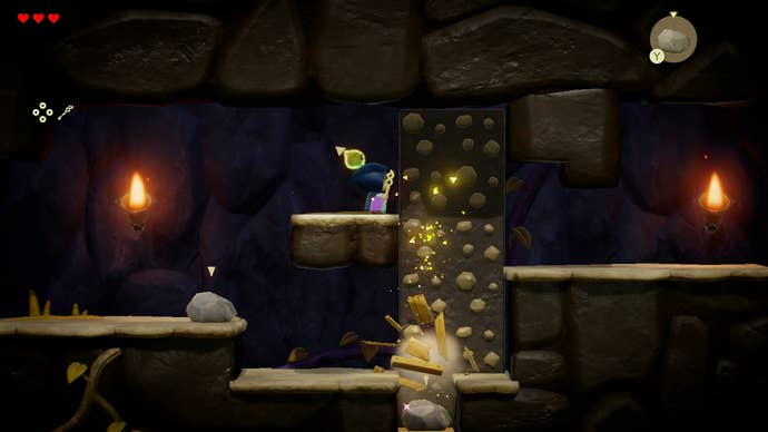 Princess Zelda drops a rock on some boxes in the Beach Cave in Zelda: Echoes of Wisdom.