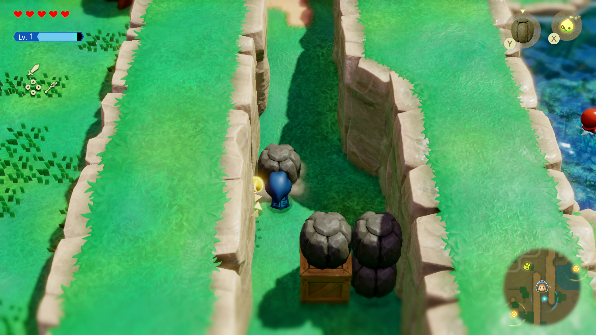 Princess Zelda pushing a boulder to clear the blocked road in Zelda: Echoes of Wisdom. - 1