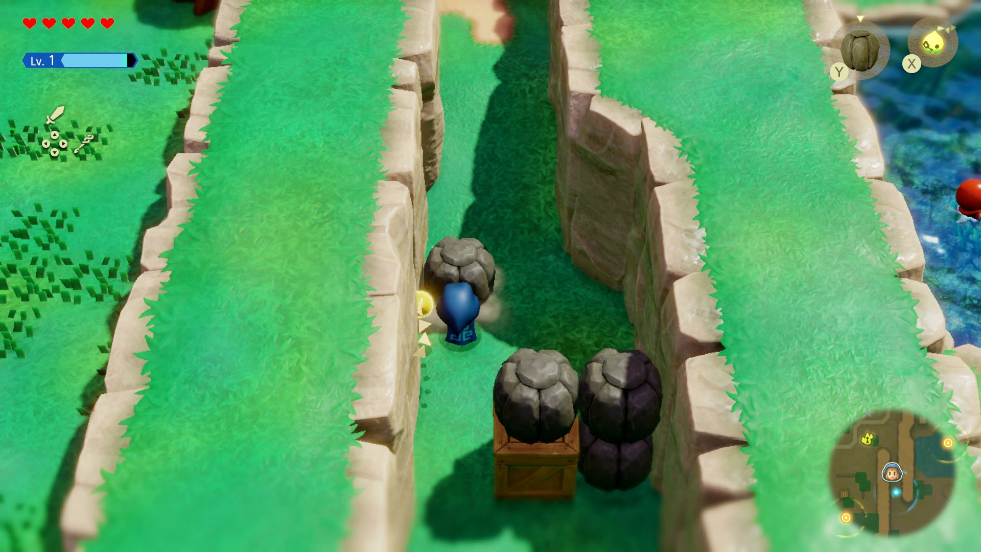 Princess Zelda pushing a boulder to clear the blocked road in Zelda: Echoes of Wisdom. - 1