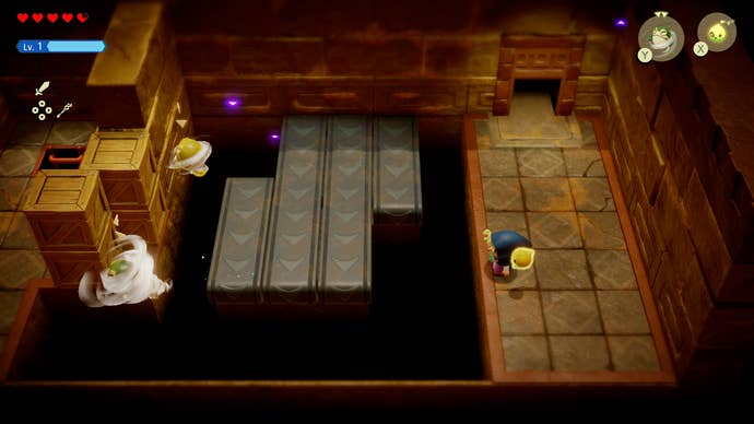 Princess Zelda blowing a gust of wind to move a wooden box in the Gerudo Sanctum in Zelda: Echoes of Wisdom.