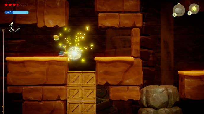 Princess Zelda drops a heavy stone onto wooden boxes in Zelda: Echoes of Wisdom.