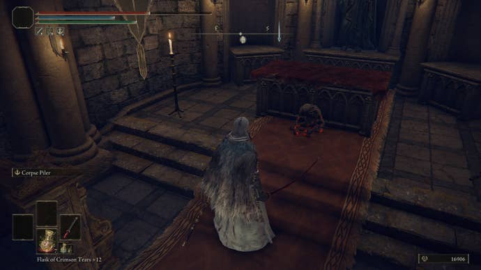 The player faces the altar in Castle Sol's Church of the Eclipse, where the Eclipse Shotel is in Elden Ring
