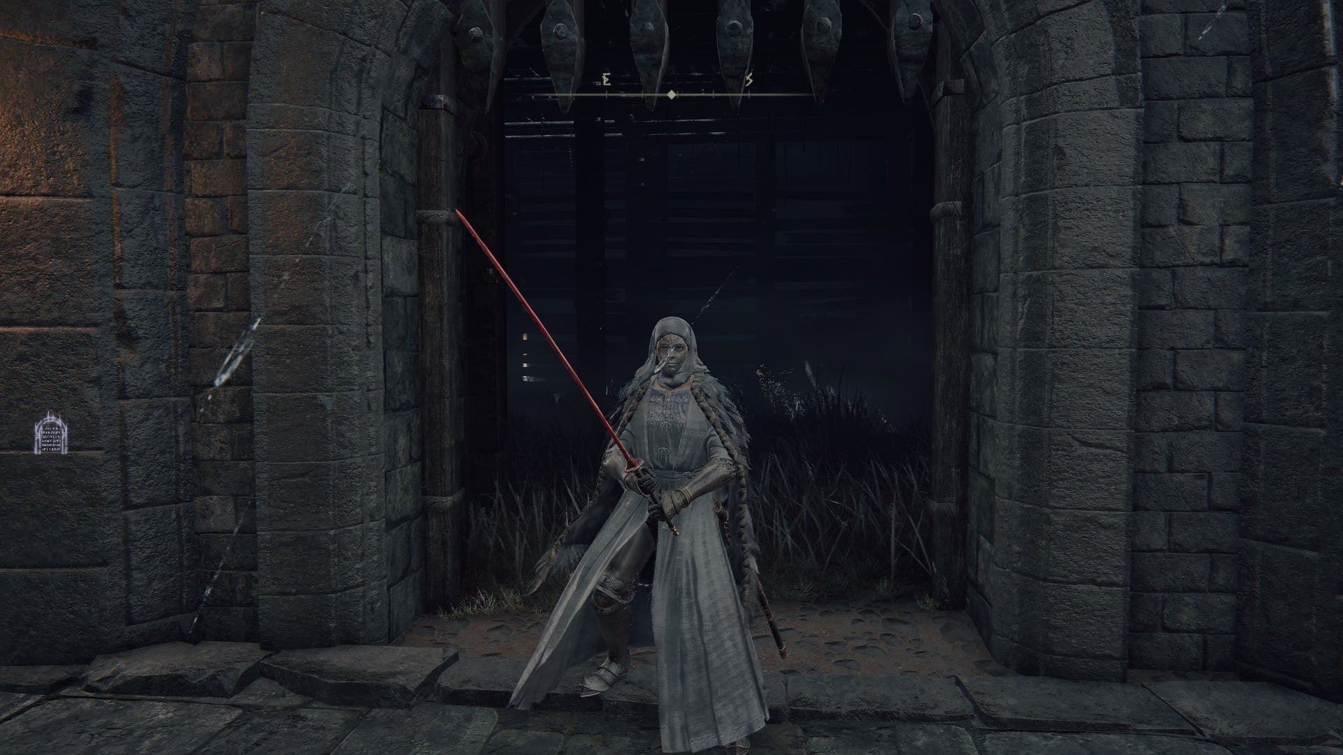 The player stands in front of the entrance to Caelid's Fort Faroth in Elden Ring - 1