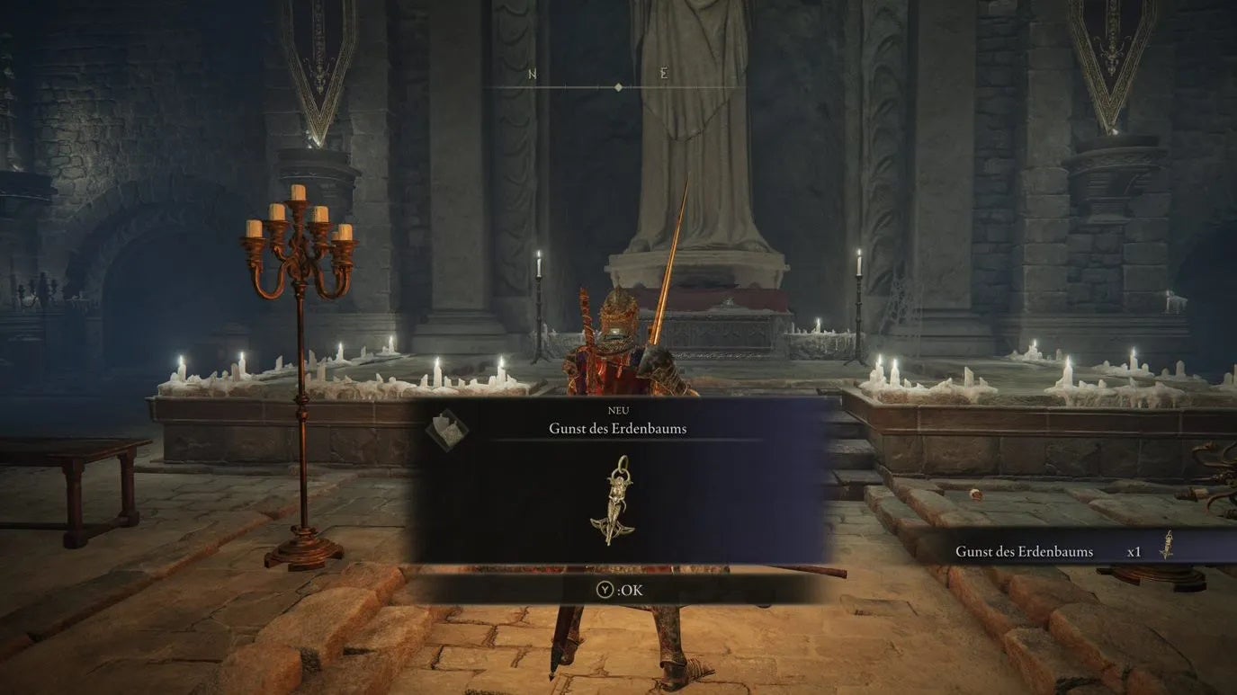 Armoured Elden Ring main character picking up an Erdtree Talisman.