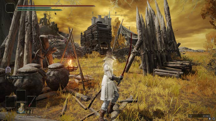 The player stands by a small encampment with an abandoned carriage, where the Giant Crusher is located, in Leyndell in Elden Ring
