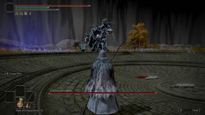 The player fights with Godefrey the Grafted inside the Golden Lineage Evergaol in Elden Ring