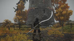 The player stands at the peak of Dominula, Windmill Village - where you fight a Godskin Apostle - while wielding the Godskin Peeler in Elden Ring