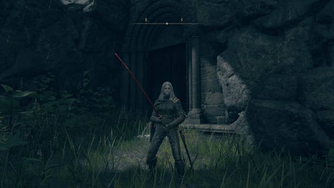 The player stands outside of the entrance to Tombsward Catacombs in Elden Ring