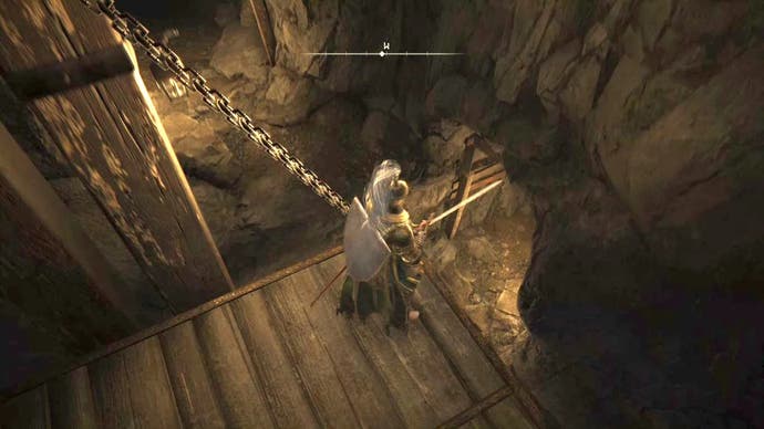Armored figure descending while riding an elevator in the Limgrave Tunnels in Elden Ring.