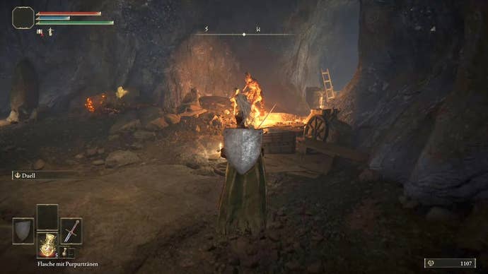 Armoured character looking at miners walking in the Limgrave Tunnels in Elden Ring.