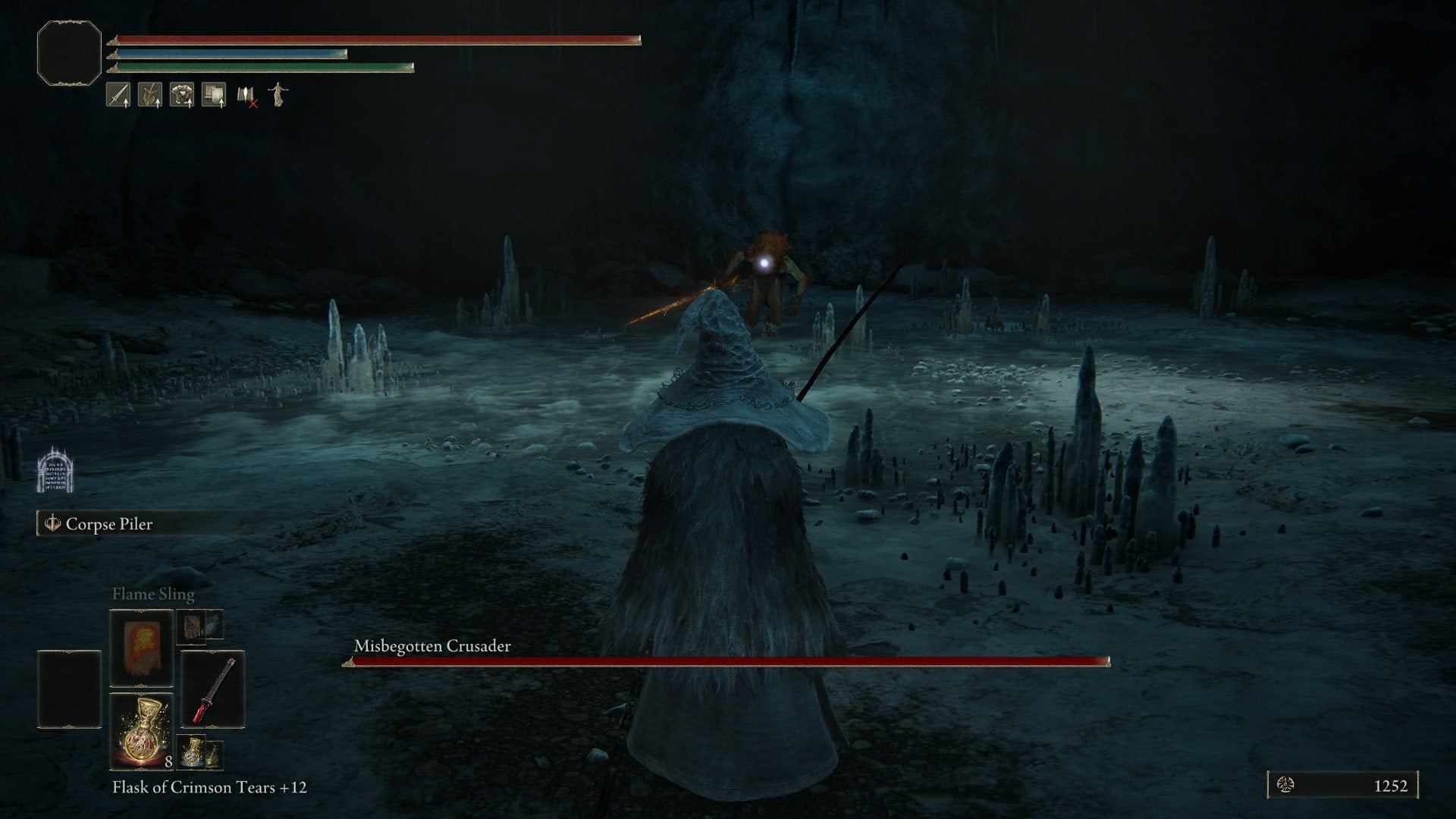 The player fights with the Misbegotten Crusader in the Cave of the Forlorn in Elden Ring