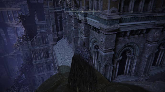 The player faces the rooftops of Night’s Sacred Ground in Elden Ring