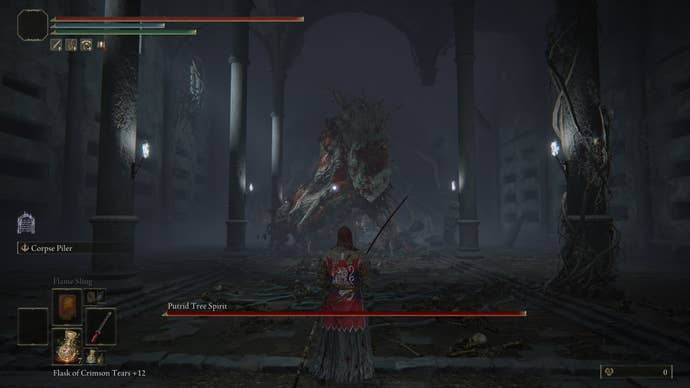 The player fights with the Putrid Tree Spirit of War-Dead Catacombs in Elden Ring