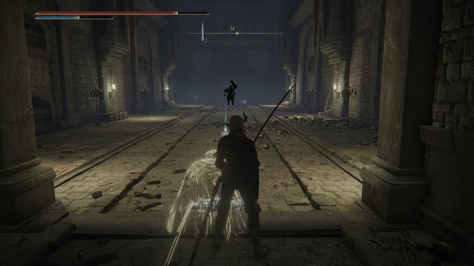The player is pursued by a dark Grave Warden in Elden Ring