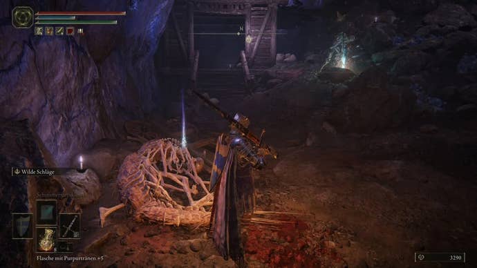 An armoured main character with a large shield on their back standing in the Sellia Crystal Tunnel in Elden Ring.