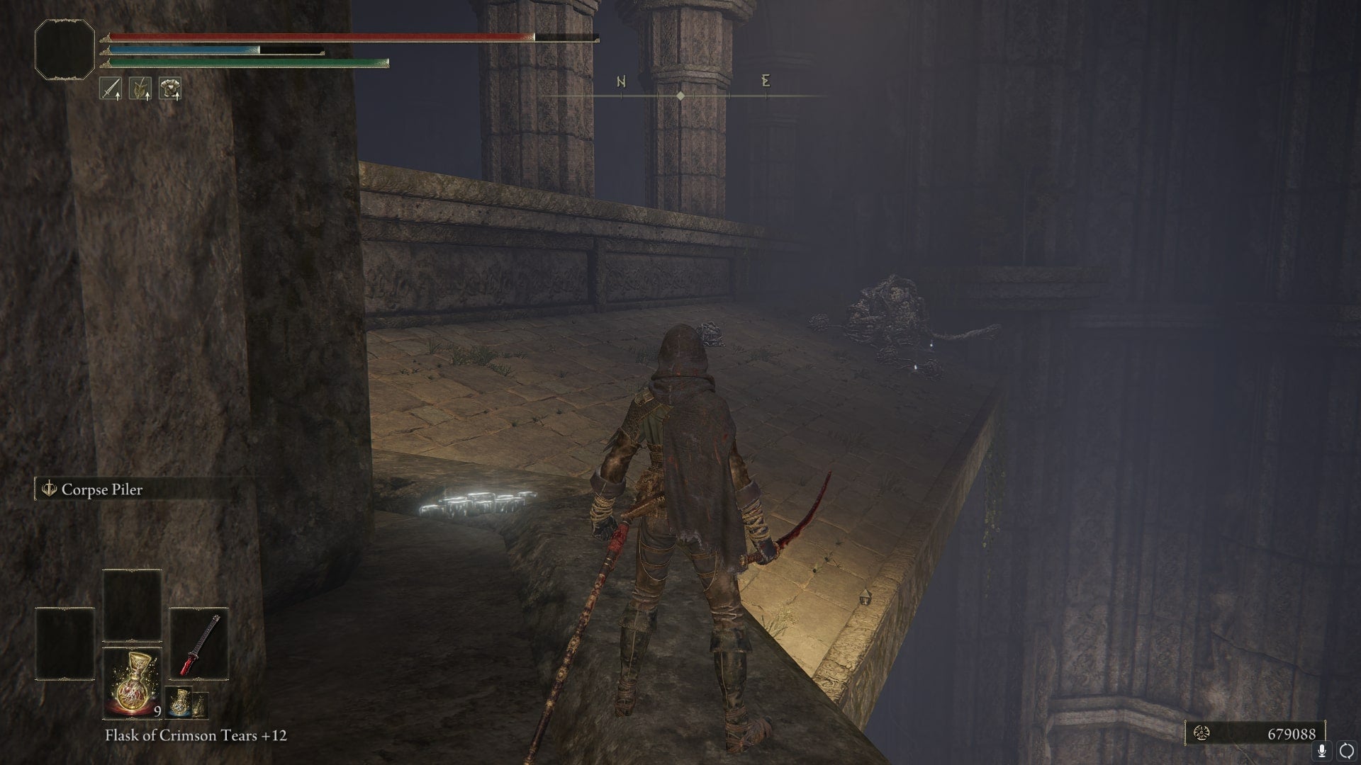 The player faces a Land Octopus at Ruin-Strewn Precipice who is guarding the Serpent God's Curved Sword in Elden Ring - 4