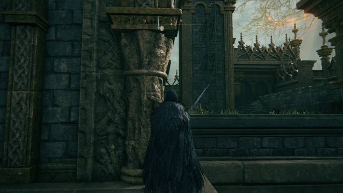 The player looks towards a ladder leading up a tower at Stormveil Castle in Elden Ring