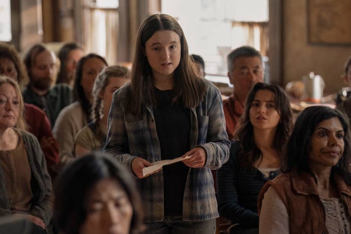 Ellie and Dina at the Jackson town meeting in The Last of Us season two