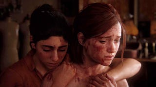 Dina hugs a weary Ellie from behind in The Last of Us Part 2