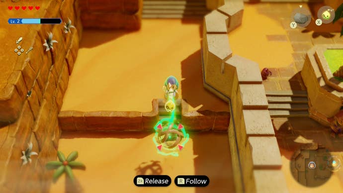 Zelda dragging a tumbleweed with her Tri Rod up a small set of stairs in Zelda Echoes of Wisdom.