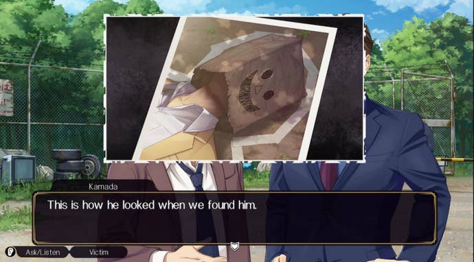 A picture of Eisuke Saski with a paper bag, decorated with a smiling face, covering his head.