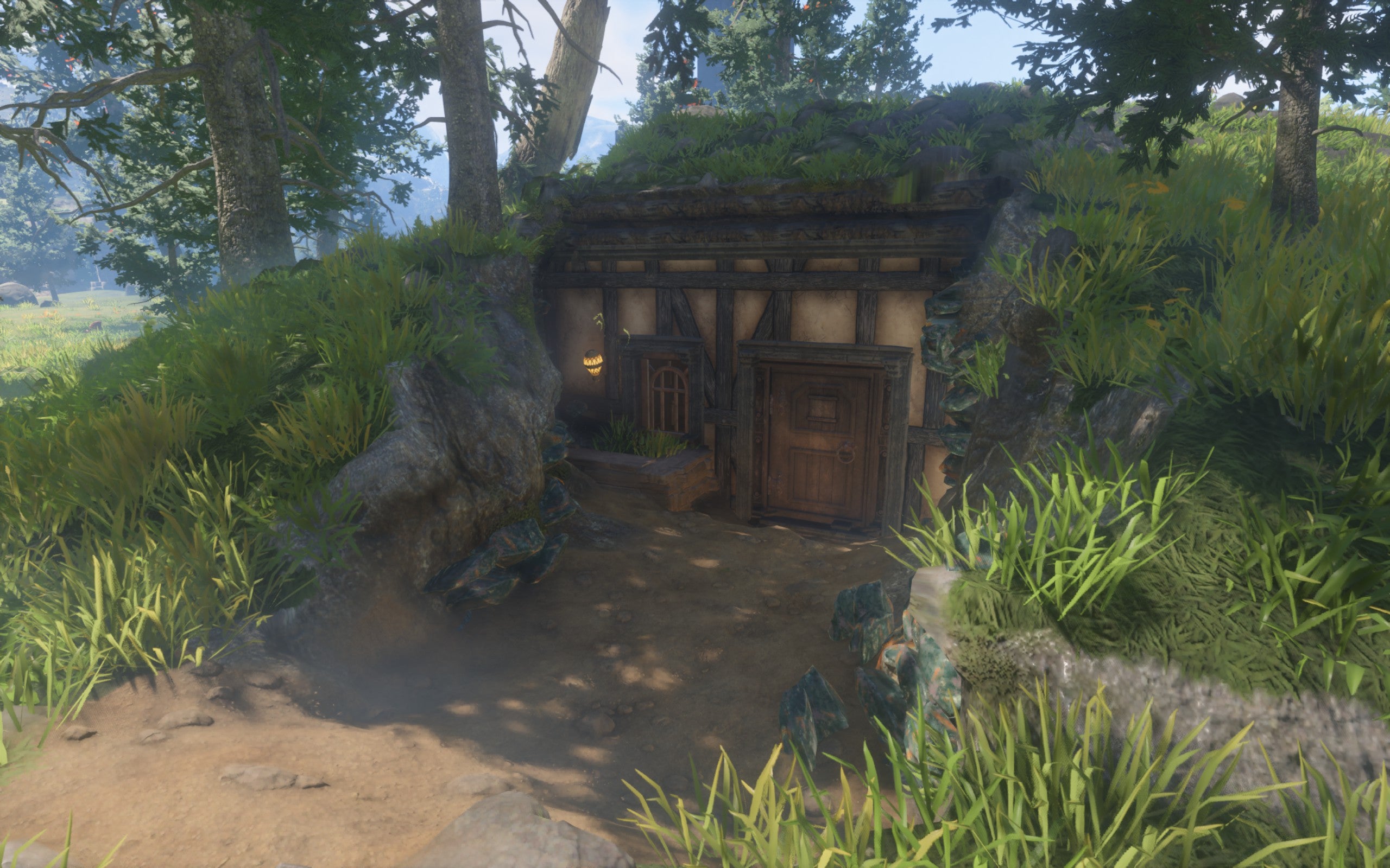 A hobbit-hole style house that has been built down into the earth, with a small window, a firefly light and a vintage wooden door.