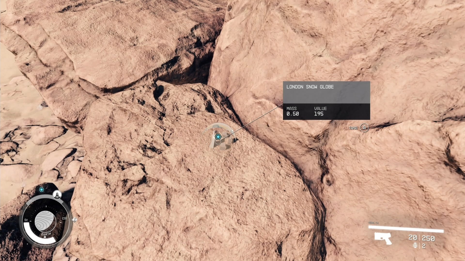 first person view looking at a london snowglobe on a dusty red rock