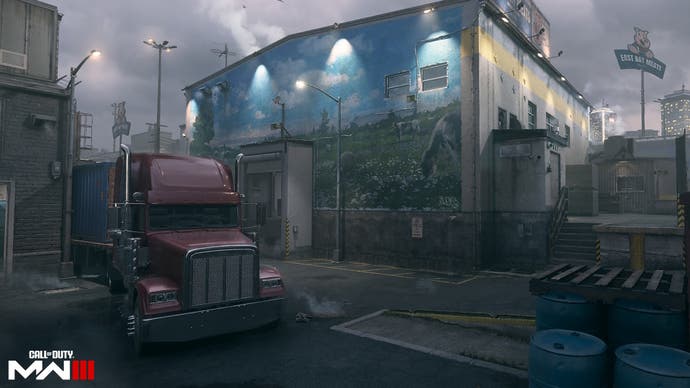 a red truck parked outside of a large building with a mural of animals in a green field painted on its side on the meat map in modern warfare 3