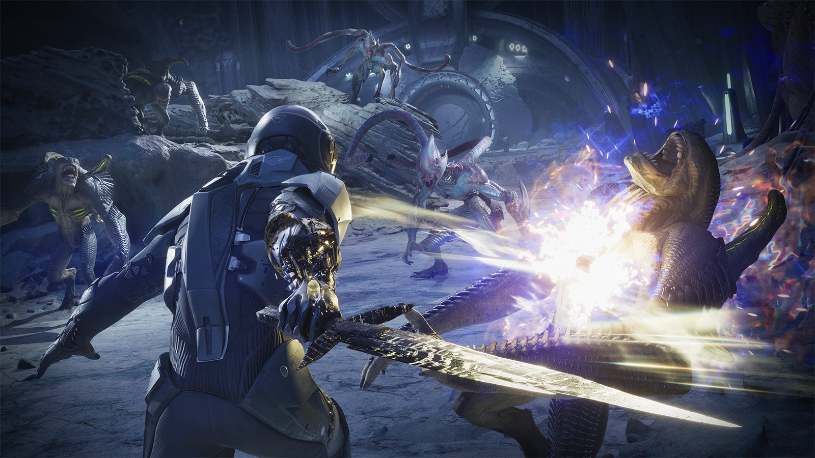 We see a character from behind as they slash at an alien creature with a sword. It's a sci-fi image rather than a fantasy one, with grey space suits and a grey environment all around.