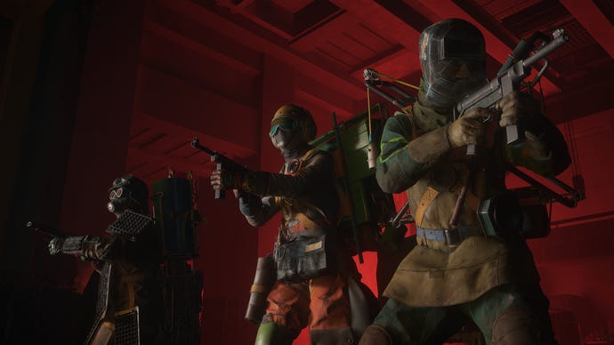 A moody changeable of 3 Firebreak squad members, lasting successful a red-lit corridor