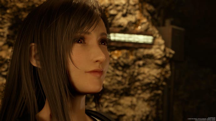 Close up of Tifa, dark haired woman, looking pensive