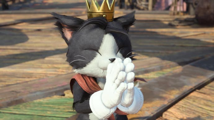 Close up of Caith Sith, cute black cat with golden crown and palms together