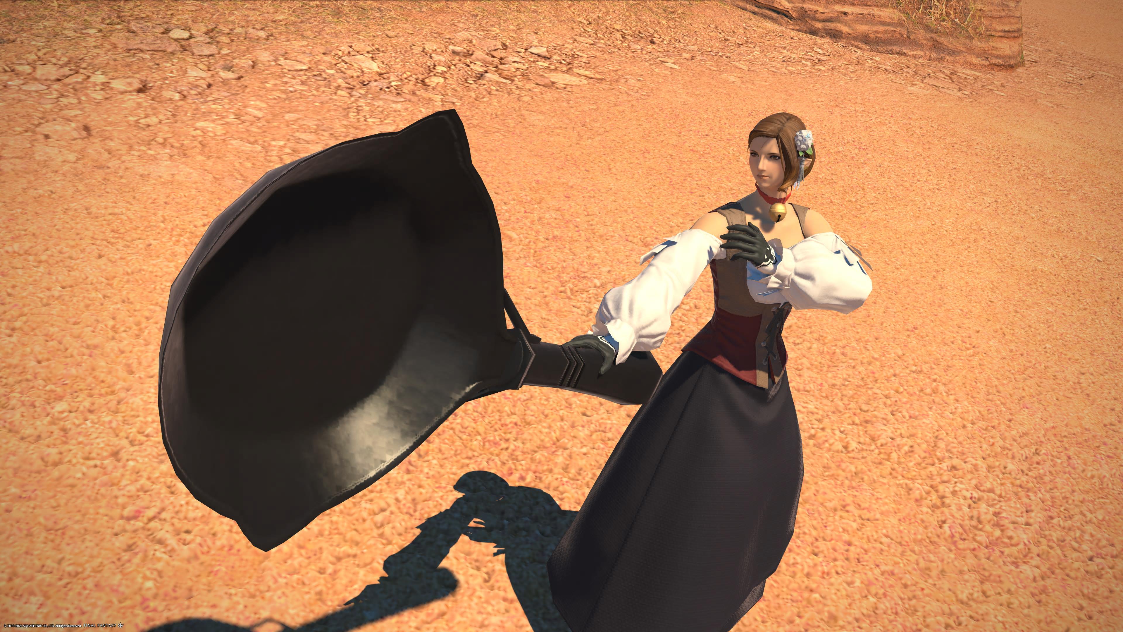 A massive frying pan, in the hands of a well-dressed human avatar in Final Fantasy 14. - 2