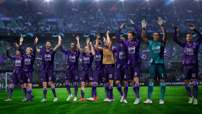 FM23 review - a team in purple kit celebrate on the pitch