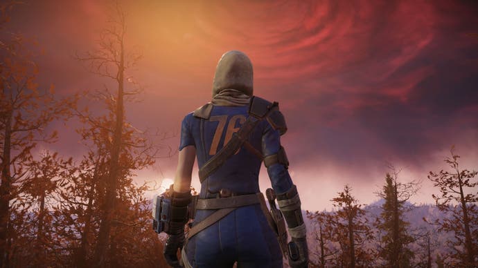 A resident of Vault 76 stands in front of an ominous red sky in Fallout 76