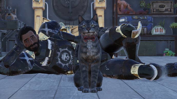 A man lies on the floor behind his cat in a red bowtie in Fallout 76.