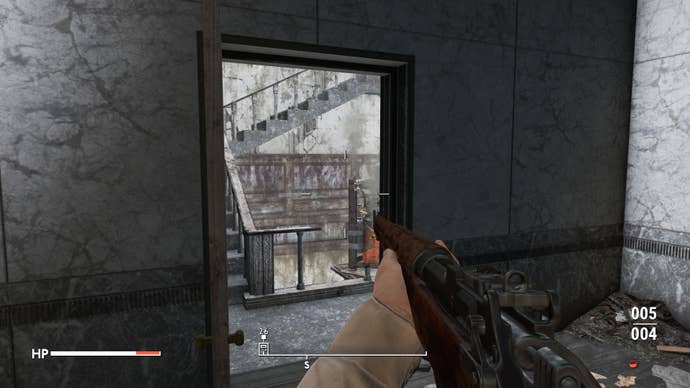 The player looks through a doorway at a stairwell with a flamethrower trap in Fallout 4 mod, Fallout London