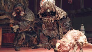 wo Mole Miners looking at a mole rat in the Fallout series