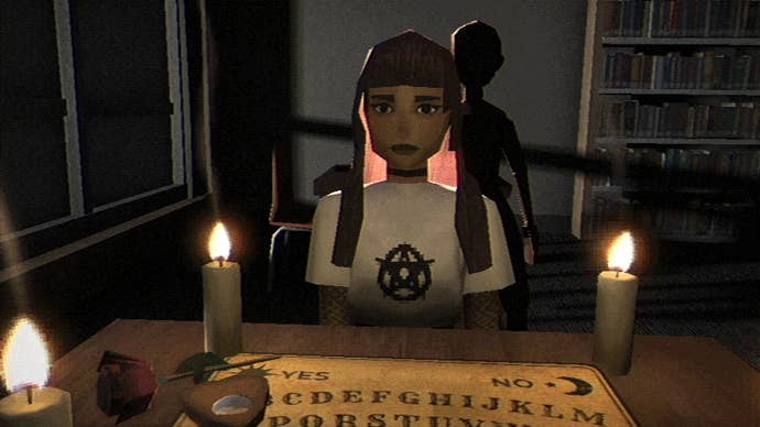 Vivian faces Amy across the table in Fear the Spotlight, with an ouija board in front of them and a figure behind Amy