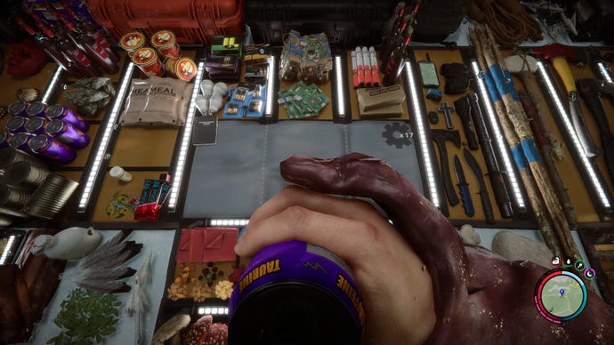 A player drinks an energy drink while looking at a crafting mat chock full of different items in Sons Of The Forest