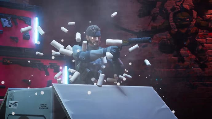 Metal Gear Solid star Snake pops out of a cardboard box, aiming a pistol at an unseen foe in this Fortnite Chapter 5 screenshot.