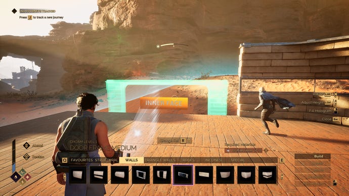 A player placing building templates in Dune: Awakening