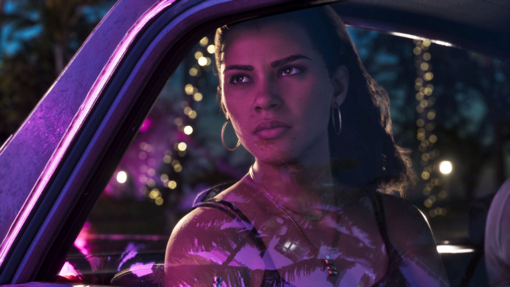 GTA 6's Lucia looks solemnly out of a car window. City lights reflect in the glass.
