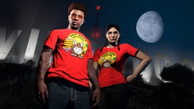 Two GTA Online characters in seasonal red t-shirts standing in front of GTA V's Vinewood sign at night.