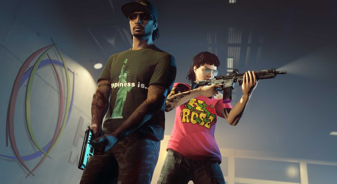 GTA Online, Official Rockstar image of two players holding weapons in a warehouse. - 1