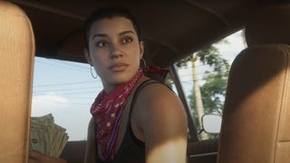 Lucia sits in the front seat of a car looking back while holding a wad of cash in the GTA VI trailer