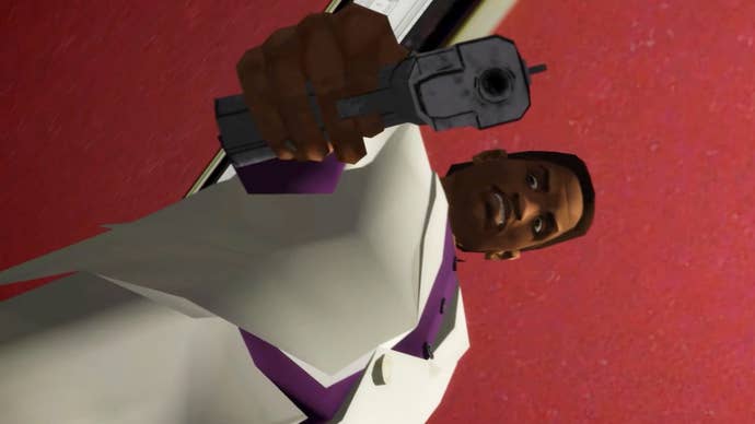 Screenshot from GTA Vice City Nextgen Edition showing a male character in a white suit and purple shirt pointing a gun